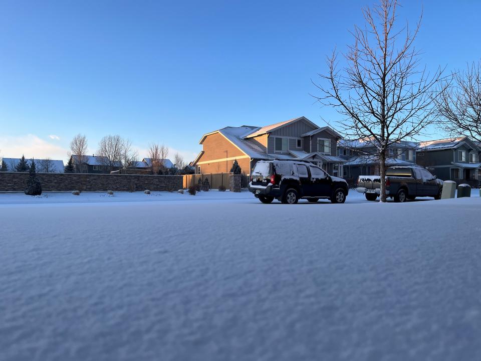Snow blankets a driveway in Timnath, Colo., on Saturday, Jan. 13, 2024, after cold air brought a 49-degree temperature drop to the Fort Collins area overnight.