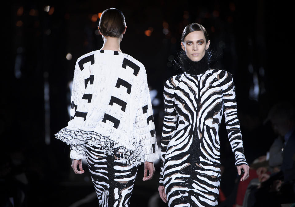 Models wear designs from the Tom Ford collection during London Fashion Week, Monday, Feb. 18, 2013, London. (Photo by Jonathan Short/Invision/AP)