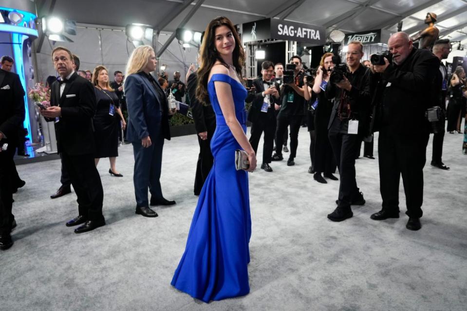 Anne Hathaway wore blue for her “The Devil Wears Prada” reunion, as a tribute to an iconic scene. Chris Pizzello/Invision/AP