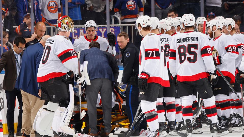 Erik Brannstrom of the Ottawa Senators was injured on a check by Islanders forward Cal Clutterbuck of the New York Islanders. (Photo by Bruce Bennett/Getty Images)