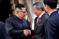 North Korea's leader Kim Jong Un shakes hands with Singapore's Foreign Minister Vivian Balakrishnan after arriving in Singapore June 10, 2018. Singapore's Ministry of Communications and Information/Handout via REUTERS