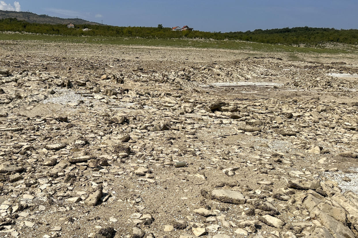 The dried out Bileca lake, near the town of Bileca, Bosnia, Thursday, Sept. 5, 2024. Experts say the summer of 2024 in the Balkans was the hottest since measurements started more than 130 years ago. (AP Photo/Eldar Emric)