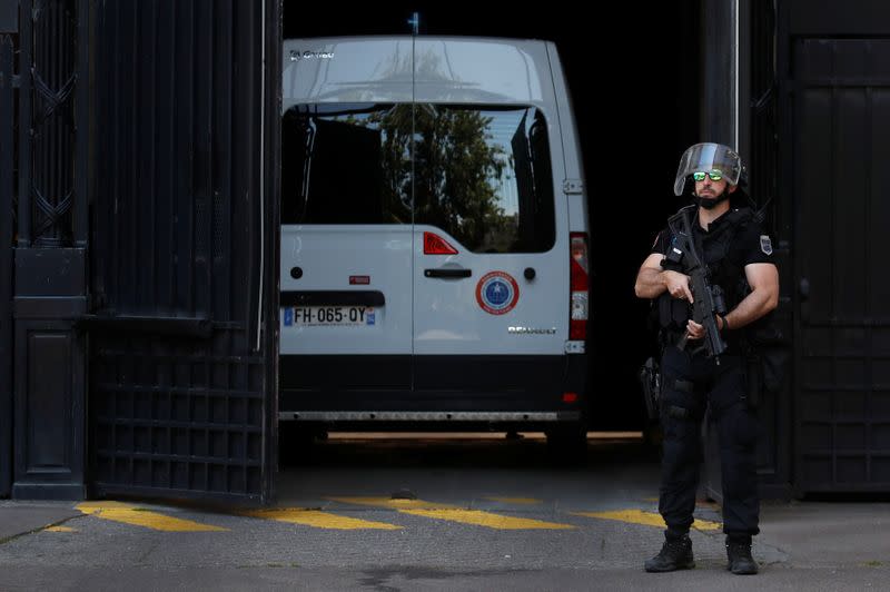 A police convoy believed to be carrying Rwandan genocide fugitive Felicien Kabuga arrives at the Paris courthouse