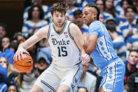 North Carolina forward Armando Bacot guards Duke center Ryan Young (15) in the first half of an NCAA college basketball game on Saturday, Feb. 4, 2023, in Durham, N.C. (AP Photo/Jacob Kupferman)