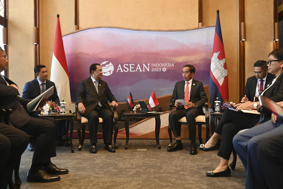 Indonesian President Joko Widodo, center right, talks with Cambodia's Prime Minister Hun Sen, center left, during their bilateral meeting on the sidelines of the 42nd ASEAN Summit in Labuan Bajo, East Nusa Tenggara, Indonesia, Wednesday, May 10, 2023. (Aprillio Akbar/Pool Photo via AP)