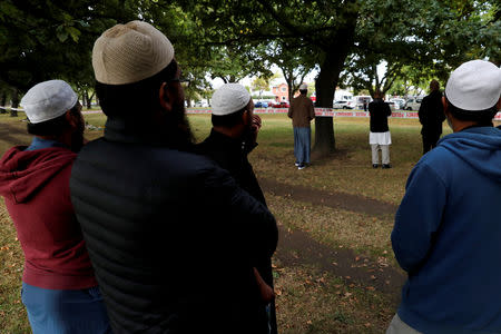 Muslims are seen near a police line outside Masjid Al Noor mosque in Christchurch, New Zealand, March 17, 2019. REUTERS/Jorge Silva