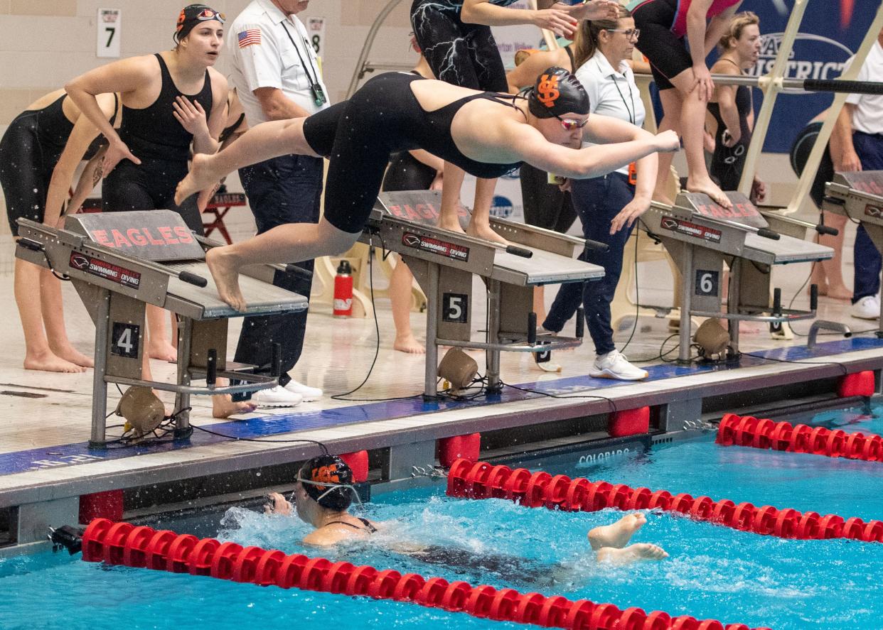 York Suburban's Chloe Moore (top) and Pyta Billet (in pool) teammed up with Sarah Koller and Brynn Neidigh to capture third place in the 200-yard freestyle at the PIAA Class 2A swimming championships.