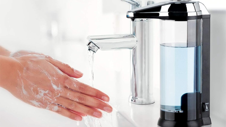 hands being washed near the touch-free soap dispenser