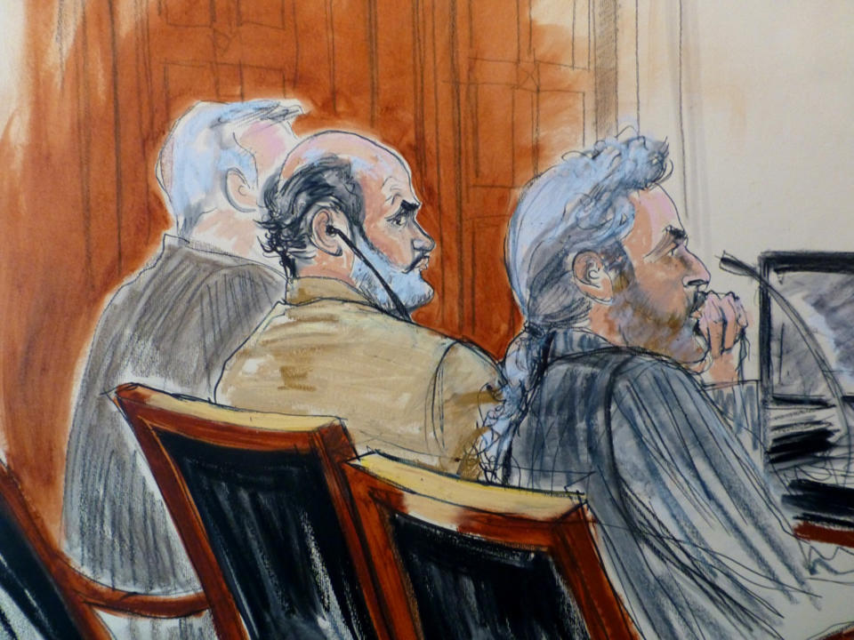 In this courtroom sketch, Sulaiman Abu Ghaith, center, is flanked by his legal team Monday, March 3, 2014 during jury selection at the start of his trial in New York on charges that he conspired to kill Americans and support terrorists in his role as al-Qaida's spokesman after the Sept. 11 attacks. Abu Ghaith is Osama bin Laden's son-in-law and is the highest-ranking al-Qaida figure to face trial on U.S. soil since the Sept. 11 attacks. Seated at right is defense attorney Stanley Cohen. (AP Photo/Elizabeth Williams)