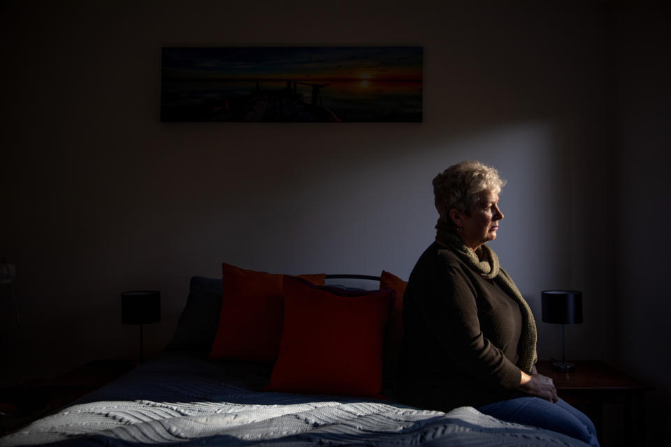 Deb Ware sits for a photo in the room of her home where her son Sam had been staying periodically for the past three years while battling an opioid addiction, in Fountaindale, Central Coast, Australia, Thursday, July 18, 2019. For three years, Deb has battled to save Sam's life, a lonely war against a system that made pharmaceutical opioids cheap and easy to get, in a country that has quietly endured what was once thought to be a uniquely American crisis of skyrocketing opioid addiction and deaths. (AP Photo/David Goldman)