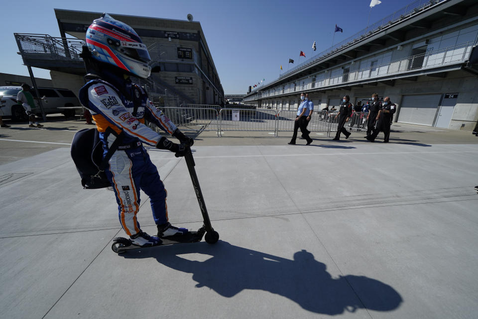 Takuma Sato, of Japan, makes his way to pit lane before qualifications for the Indianapolis 500 auto race at Indianapolis Motor Speedway, Saturday, Aug. 15, 2020, in Indianapolis. (AP Photo/Darron Cummings)