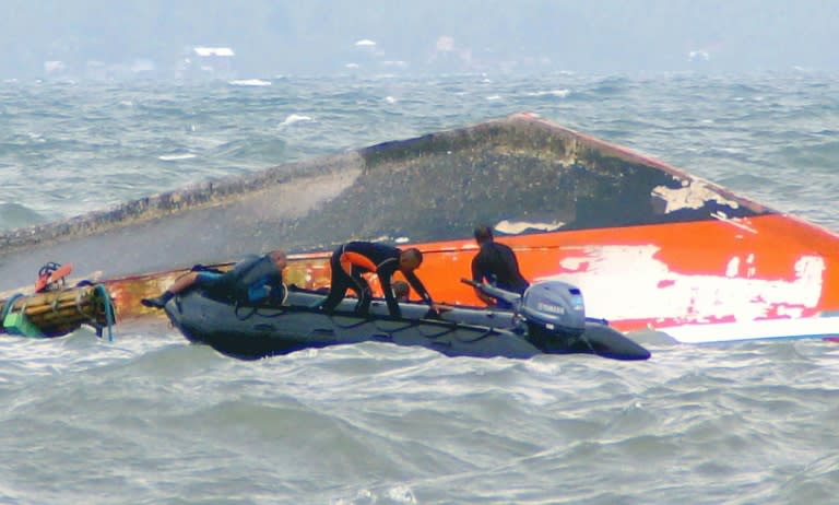 Rescuers battle rough seas as they search for survivors from the Kim Nirvana ferry near the pier in Ormoc City, central Philippines, on July 3, 2015