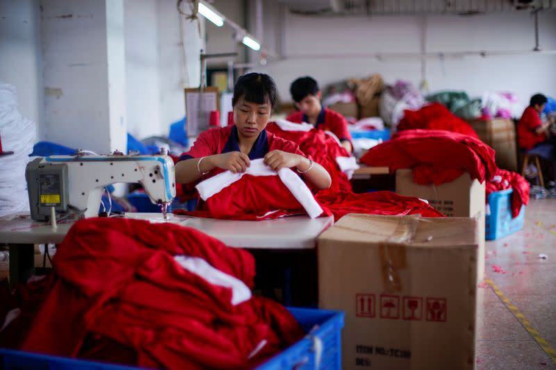 Employees make Christmas products at Fuye toy factory following the coronavirus disease (COVID-19) outbreak in Yiwu