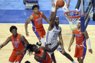 Kentucky's Isaiah Jackson (23) shoots near Florida defenders Omar Payne (5), Anthony Duruji (4),Noah Locke (10) and Tre Mann (1) during the second half of an NCAA college basketball game in Lexington, Ky., Saturday, Feb. 27, 2021. (AP Photo/James Crisp)