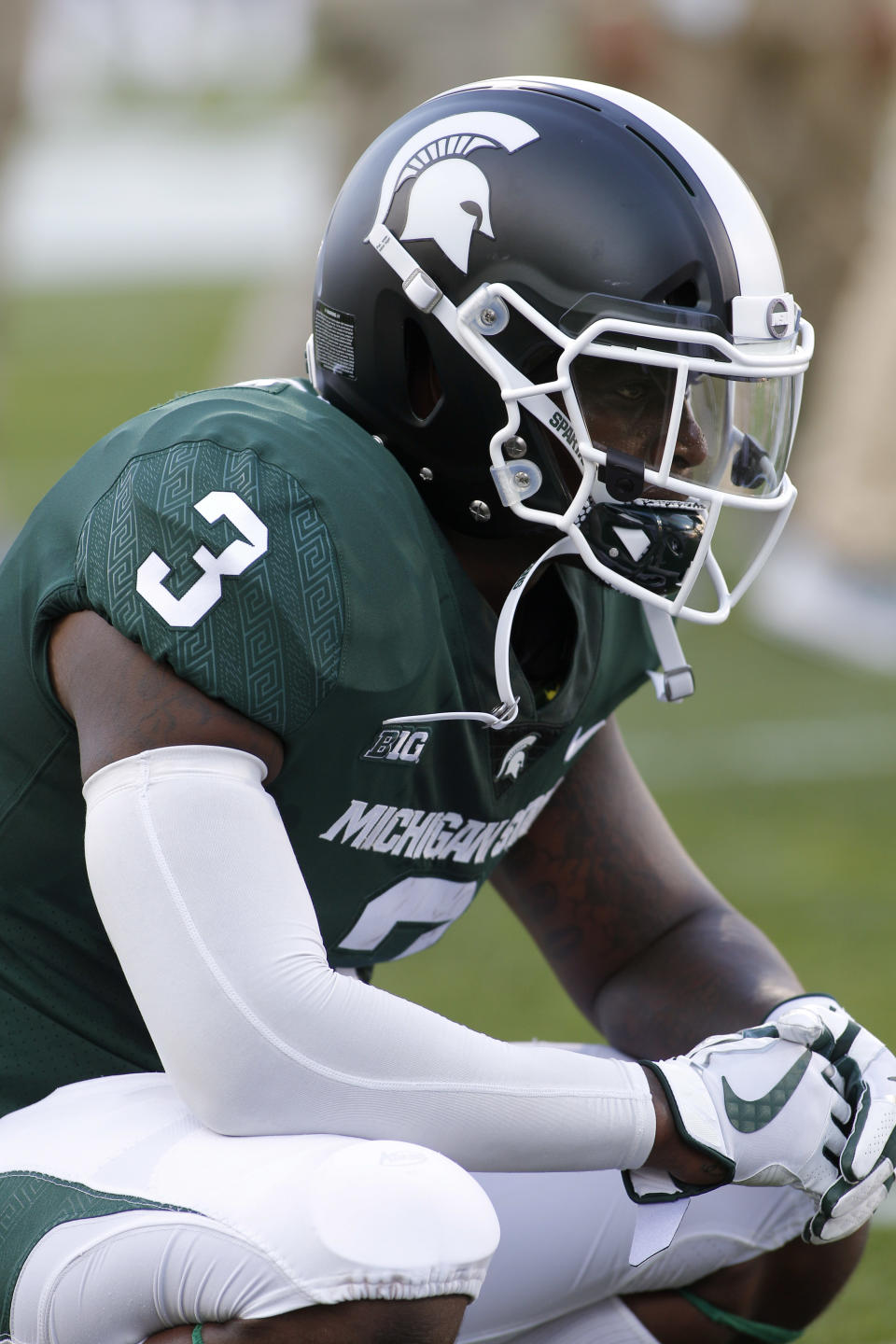 Michigan State running back LJ Scott pauses before an NCAA college football game against Utah State, Friday, Aug. 31, 2018, in East Lansing, Mich. (AP Photo/Al Goldis)