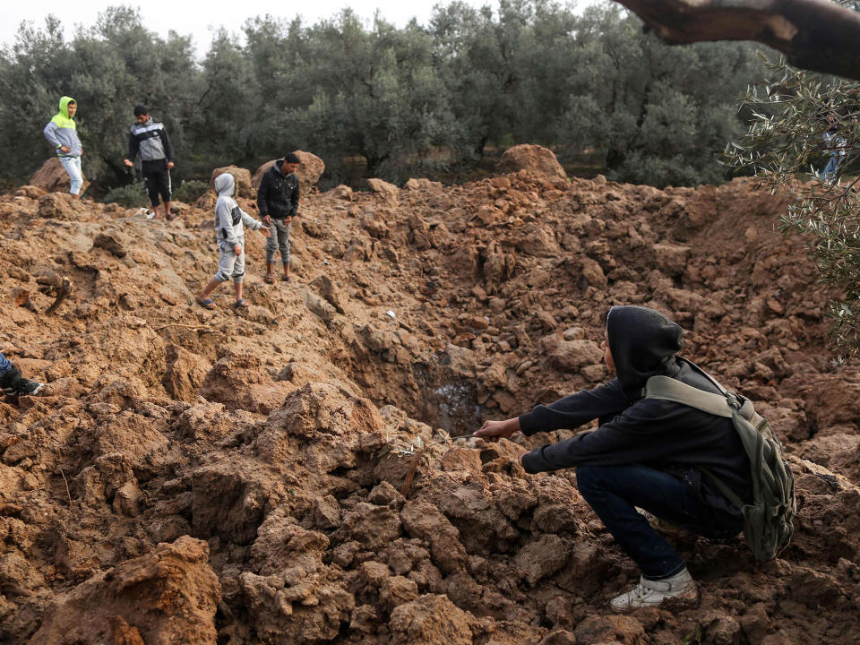 Two Palestinians were killed by Israeli fire, Gaza medical sources said, after four soldiers were wounded in an apparent bomb attack on the border with the Palestinian enclave: MAHMUD HAMS/AFP/Getty Images