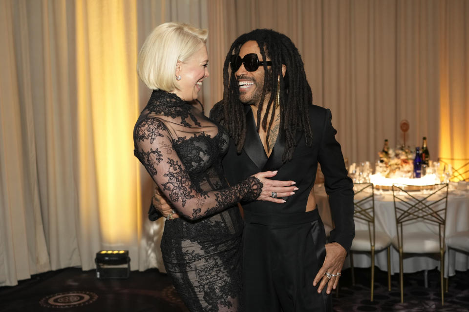 Hannah Waddingham, left, and Lenny Kravitz arrive at the 81st Golden Globe Awards on Sunday, Jan. 7, 2024, at the Beverly Hilton in Beverly Hills, Calif. (AP Photo/Chris Pizzello)