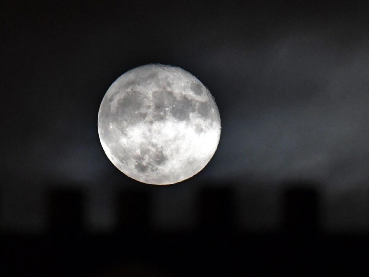A supermoon, which occurs when a full moon passes closest to the Earth, can appear even bigger when it is close to the horizon thanks to an optical illusion: AFP/Getty Images