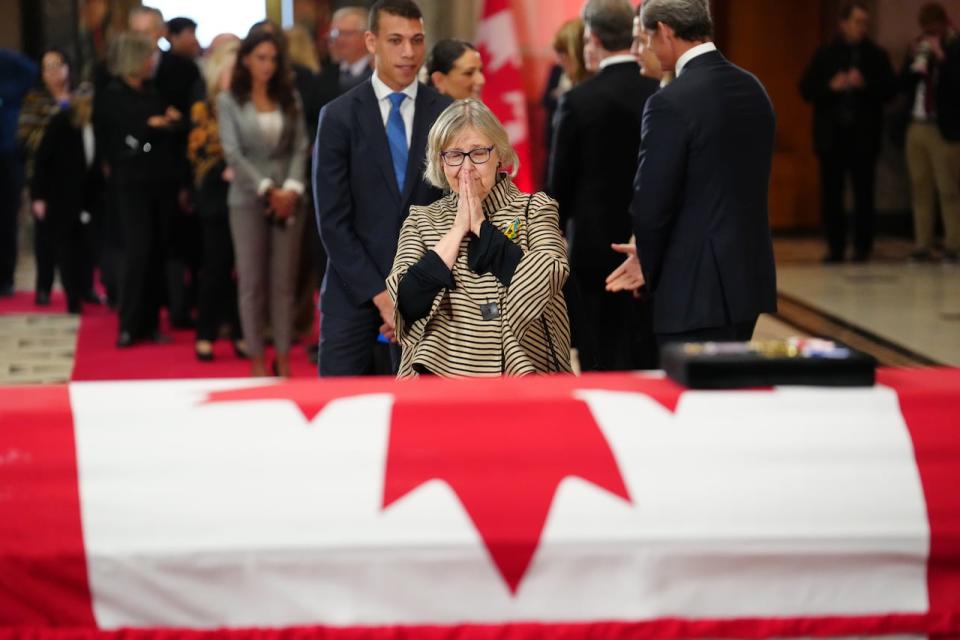 Green Party Leader Elizabeth May pays her respects at the casket of former prime minister Brian Mulroney as he lies in state at the Sir John A. Macdonald building opposite Parliament Hill in Ottawa on Tuesday, March 19, 2024. 