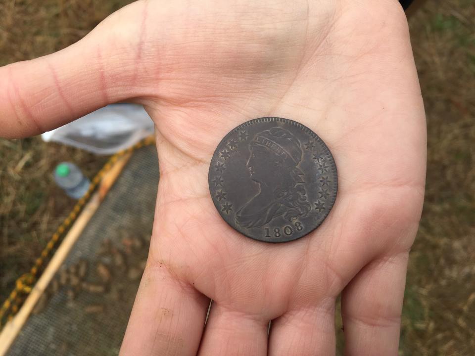 In this image provided by the Maryland Department of Transportation, an 1808 coin is shown that was found at a site on Maryland’s Eastern Shore, is displayed on March, 25, 2021, near Church Creek, Md., where archaeologists believe Harriet Tubman’s father lived. (Maryland Department of Transportation via AP)