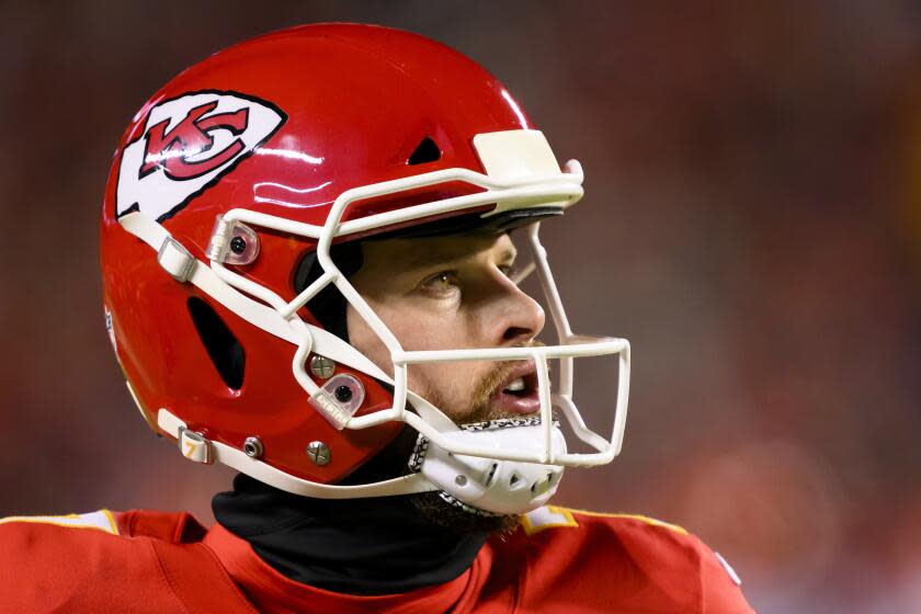 Kansas City Chiefs place kicker Harrison Butker looks to the scoreboard during a game