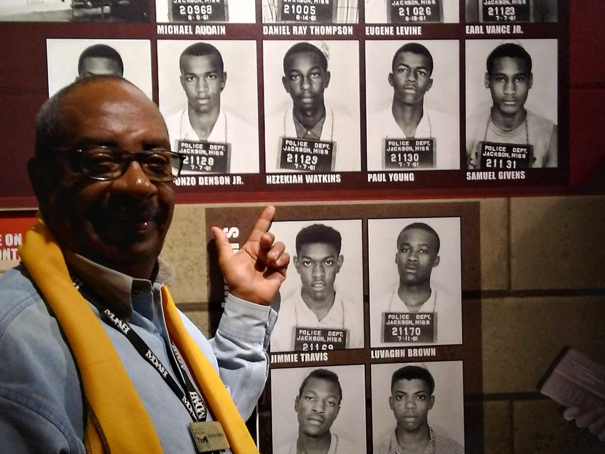 Hezekiah Watkins points out his arrest mugshot as a young man, in an exhibit at the Mississippi Civil Rights Museum, in Jackson, Miss.