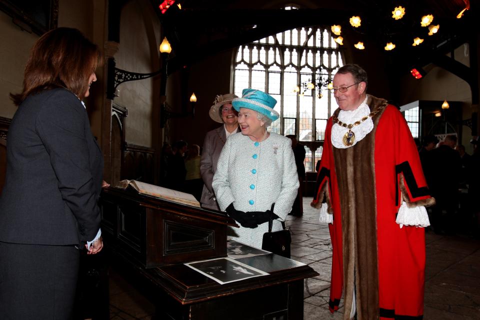 NORFOLK, ENGLAND - FEBRUARY 6: Queen Elizabeth II views exhibits and meets local dignitaries during a visit to Kings Lynn Town Hall on February 6, 2012 in Norfolk, England. Today is Accession Day, with the Queen celebrating 60 years to the day since she became Monarch. (Photo by Chris Radburn - WPA Pool/Getty Images)