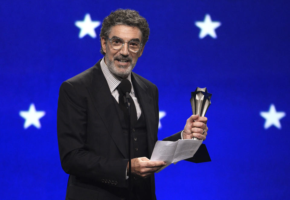 FILE - In this Jan. 13, 2019, file photo, Chuck Lorre accepts the creative achievement award at the 24th annual Critics' Choice Awards at the Barker Hangar in Santa Monica, Calif. The end of “The Big Bang Theory” means the beginning of a familiar debate: is the traditional sitcom, complete with laugh track, a thing of the past? The hit CBS comedy concludes its 12-year run on Thursday, May 16. (Photo by Chris Pizzello/Invision/AP)