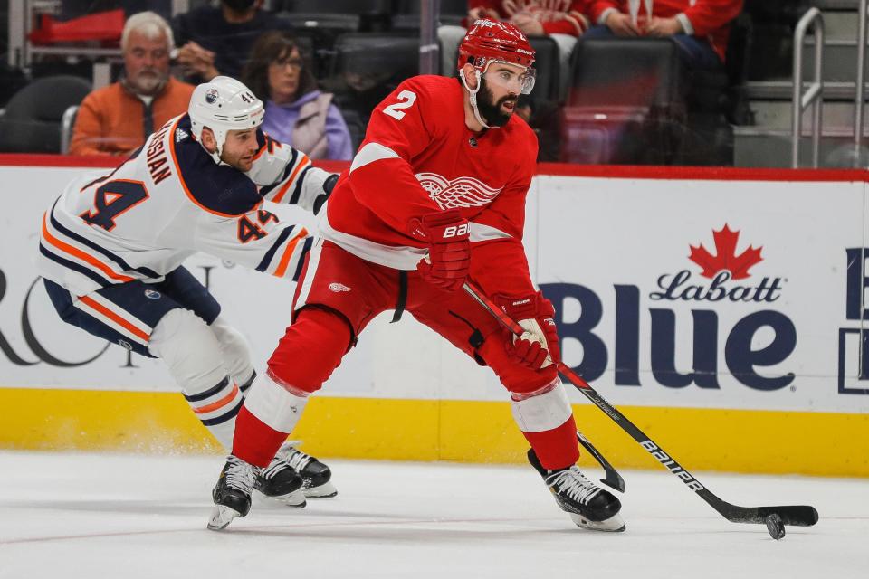 Detroit Red Wings defenseman Nick Leddy (2) shoots the puck against Edmonton Oilers right wing Zack Kassian (44) during the first period at the Little Caesars Arena in Detroit on Tuesday, Nov. 9, 2021.