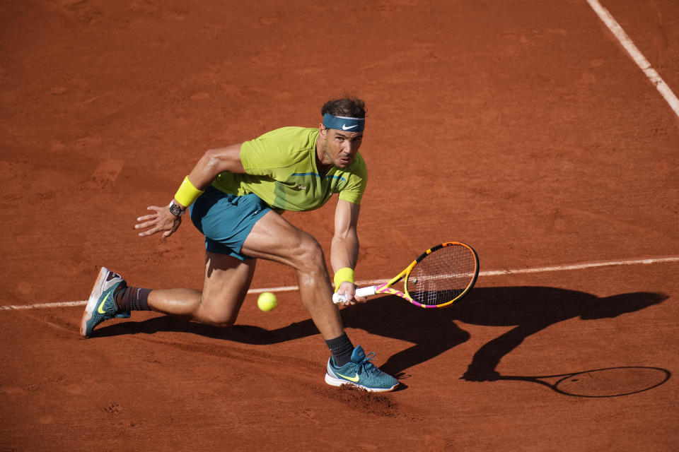 Spain's Rafael Nadal returns the ball to Netherlands' Botic van de Zandschulp during their third round match of the French Open tennis tournament at the Roland Garros stadium Friday, May 27, 2022 in Paris. (AP Photo/Christophe Ena)