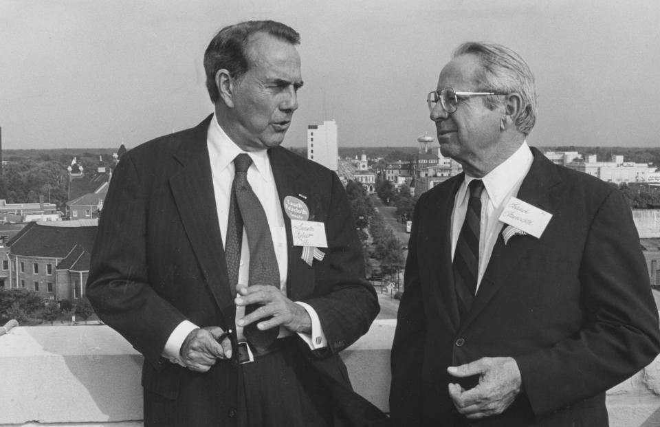 Sen. Bob Dole, left, and Lauch Faircloth talk politics atop the Prince Charles Hotel in Fayetteville, Sept. 3, 1992.