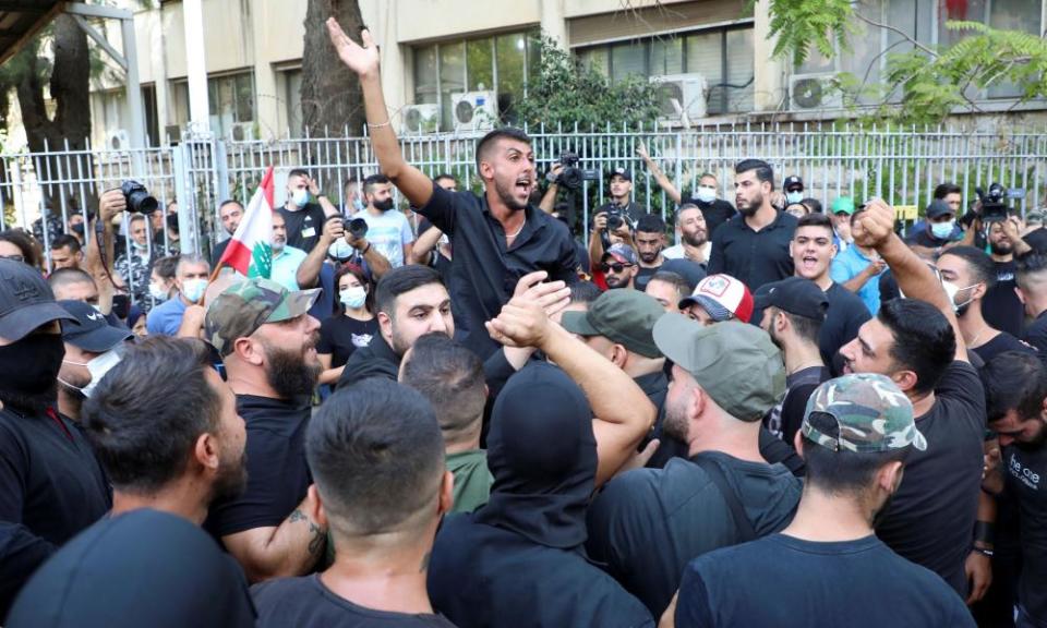 Protesters demand the removal of Tarek Bitar, the lead judge of the port blast investigation, near the justice palace in Beirut.