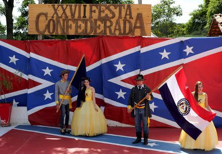 Descendants of American Southerners wearing Confederate-era dresses and uniforms parade during a party to celebrate the 150th anniversary of the end of the American Civil War in Santa Barbara D'Oeste, Brazil, April 26, 2015. REUTERS/Paulo Whitaker