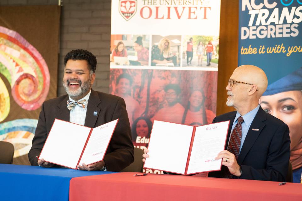 Kellogg Community College president Paul Watson and University of Olivet president Steven Corey sign a transfer agreement between the two institutions at Kellogg Community College on Wednesday, Oct. 18, 2023.