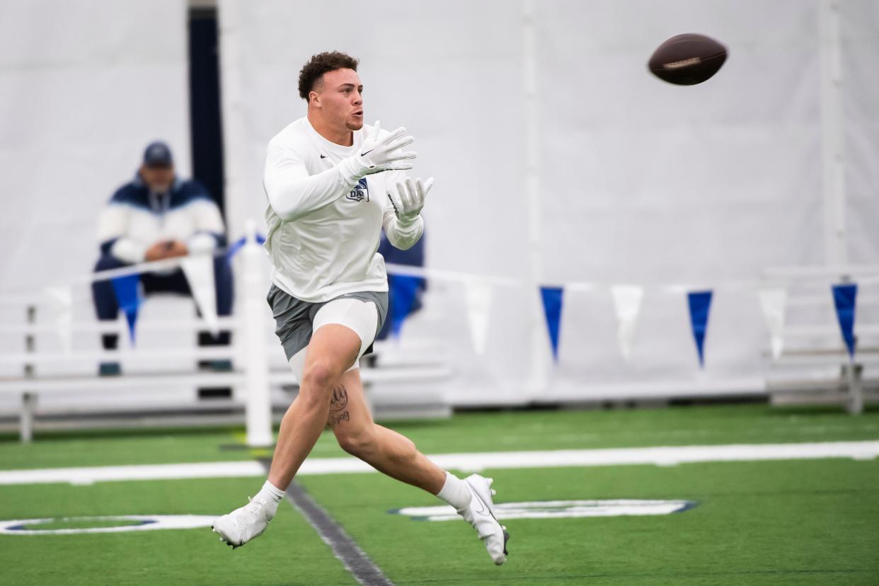 Tight end Theo Johnson catches a pass during Penn State's Pro Day in Holuba Hall on March 15, 2024, in State College.