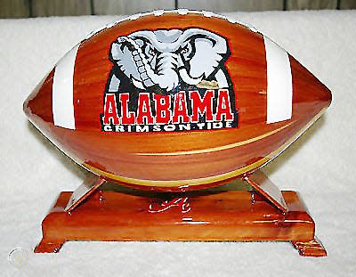One of Dennis Harker's wooden footballs commemorating the Alabama Crimson Tide's national championships. The footballs were crafted by state prison inmates.
