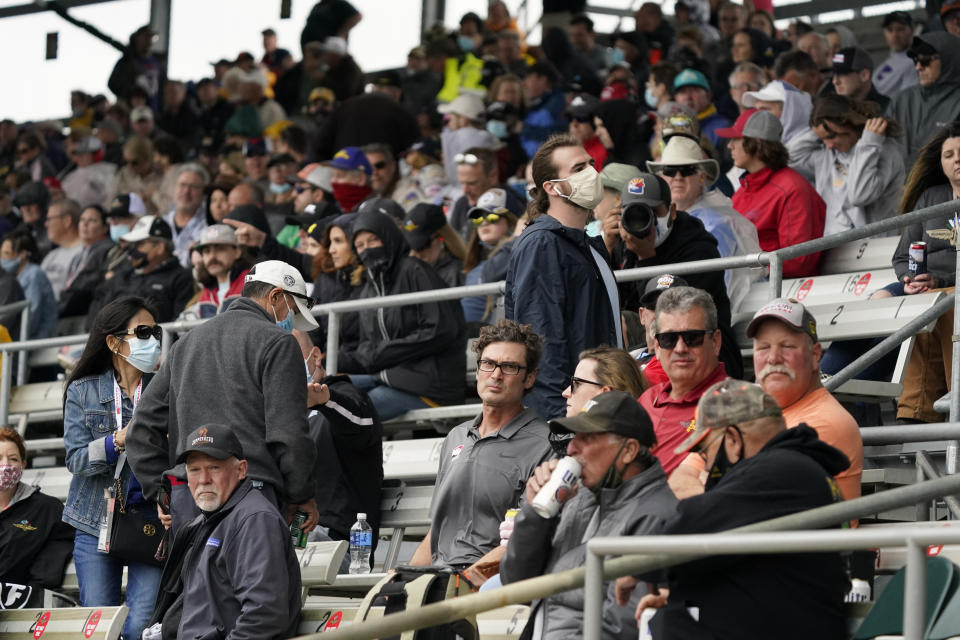 Fans watch during the final practice session for the Indianapolis 500 auto race at Indianapolis Motor Speedway, Friday, May 28, 2021, in Indianapolis. (AP Photo/Darron Cummings)