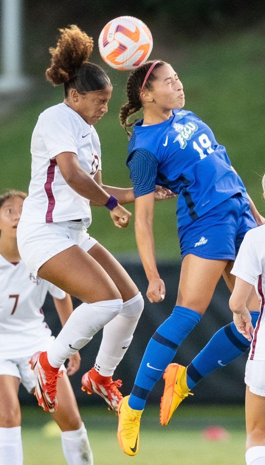 Florida Gulf Coast Eagle Malaya Melancon (19) and Florida State Seminole LeiLanni Nesbeth (13) both jump up to head the ball. The Florida State Seminoles defeated the Florida Gulf Coast Eagles 5-0 Thursday, Sept. 8, 2022.