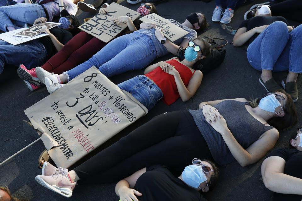 FILE - In this June 5, 2020, file photo, protesters lay silent for 8 minutes and 46 seconds during a demonstration to honor George Floyd, near the home of Sacramento Mayor Darrell Steinberg in Sacramento, Calif. For most police officers going on trial, the argument that they made a split-second decision in a life-or-death situation often carries significant weight for a jury. It's a reason officers are so rarely convicted. But it's an argument that's almost certainly not available to Derek Chauvin, the fired Minneapolis police officer who goes on trial Monday, March 29, 2021, in George Floyd's death. (AP Photo/Rich Pedroncelli, File)