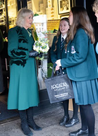 <p>Samir Hussein - Pool/Getty</p> Queen Camilla visits the Arcadia food store on March 21, 2024 in Belfast, Northern Ireland.