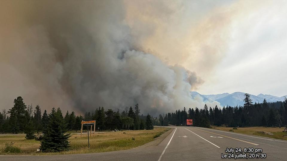 PHOTO: In this July 24, 2024, image obtained from the Jasper National Park in Canada, smoke rises from a wildfire burning in the park.  (Handout/Jasper National Park/AFP via Getty Images)