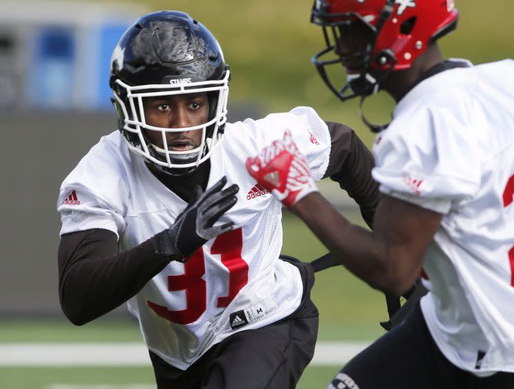 Calgary Stampeders' Osagie Odiase wears the No. 31 jersey of his fallen teammate and roommate Mylan Hicks in a team practice. (THE CANADIAN PRESS/Larry MacDougal photo)