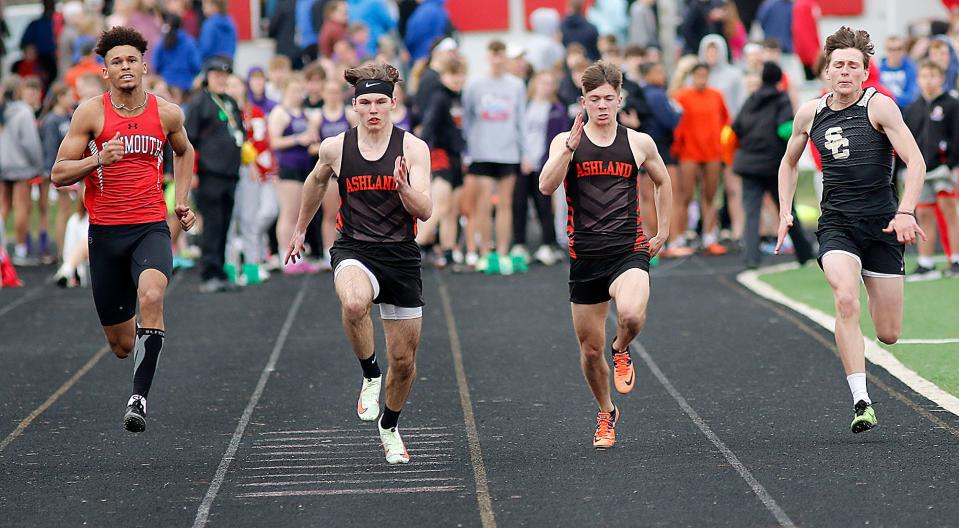 Plymouth's Caiden Allen, Ashland's Colton Johnson, Ashland's Bryce Mendenhall and South Central's Carson Music compete in the 100 meter dash during the Forest Pruner Track Invitational at Crestview High School on Friday, April 22, 2022. TOM E. PUSKAR/TIMES-GAZETTE.COM