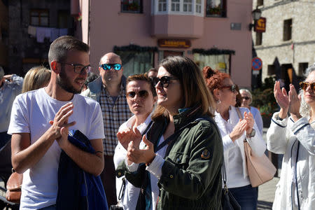 Maria Verges Perez (C) deputy mayor of Vielha, takes part in a demonstration in favour of dialogue, in Vielha, in the Val d'Aran, Catalonia, Spain October 7, 2017. Picture taken October 7, 2017. REUTERS/Vincent West