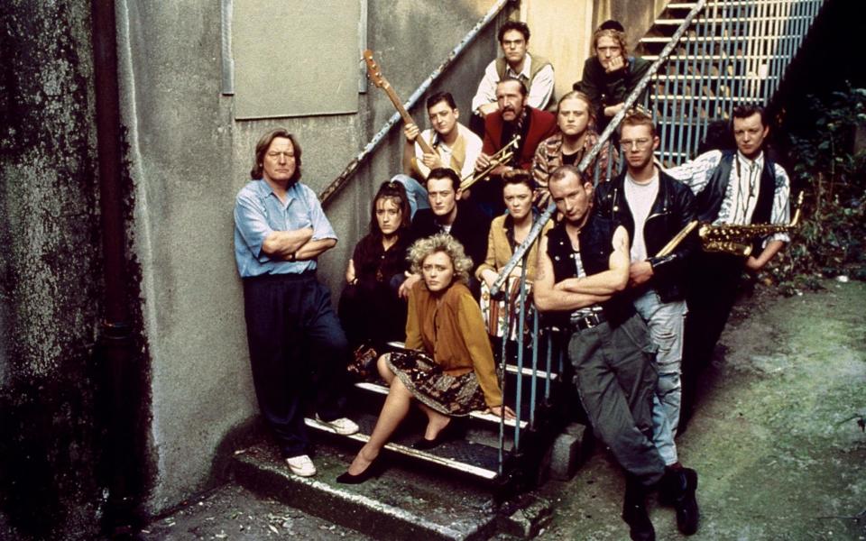 Director Alan Parker (far left) and the cast of the 1991 film The Commitments - Alamy