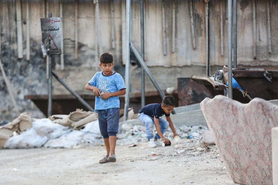 Kids play in the Palestinian refugee camp Aida, near Bethlehem, in the West Bank, on Sept. 11, 2019.