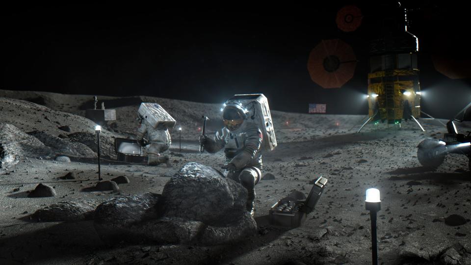 This illustration made available by NASA in April 2020 depicts Artemis astronauts on the Moon. On Thursday, April 30, 2020, NASA announced the three companies that will develop, build and fly lunar landers, with the goal of returning astronauts to the moon by 2024. The companies are SpaceX, led by Elon Musk; Blue Origin, founded by Amazon’s Jeff Bezos; and Dynetics, a Huntsville, Ala., subsidiary of Leidos. (NASA via AP)