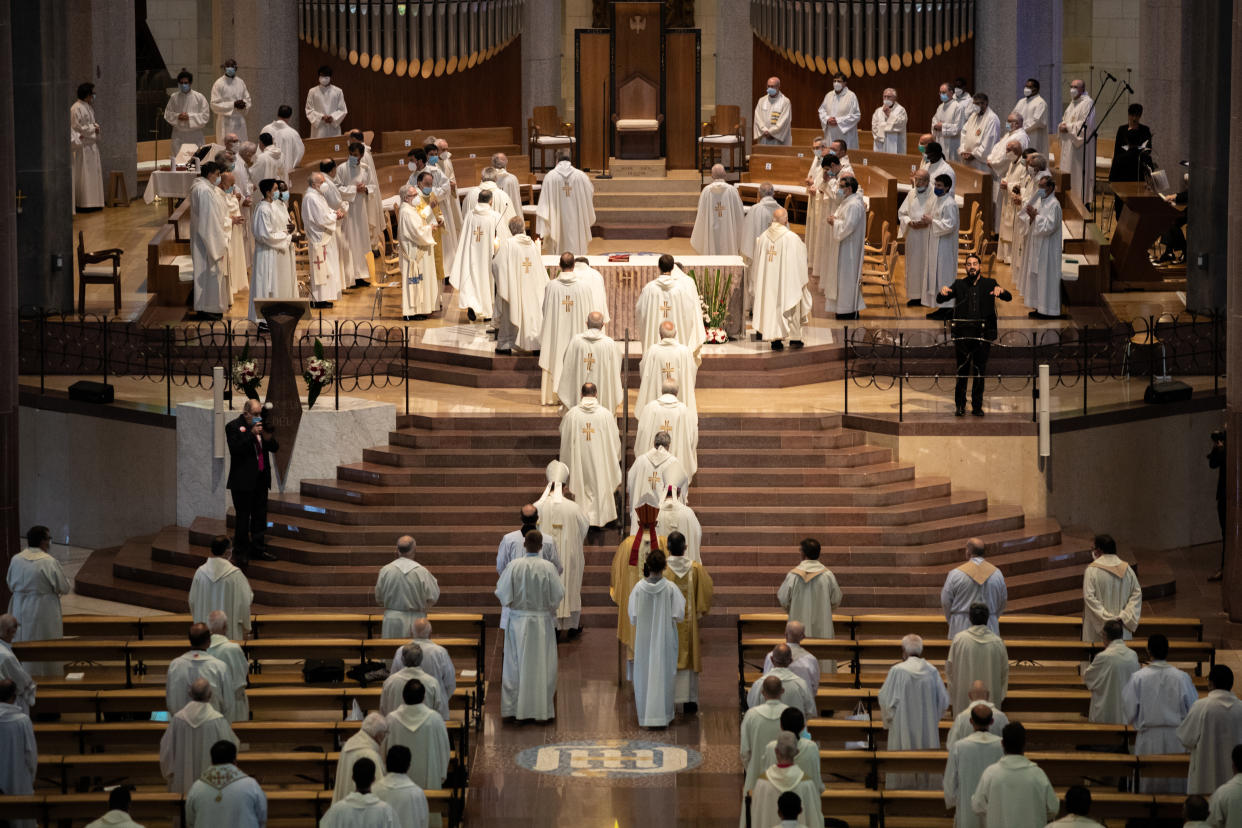 BARCELONA, SPAIN - JUNE 19: Clergy in PPE attend the celebration of the first mass in the Cathedral of the Sagrada Familia since the beginning of the state of alarm, officiated by Cardinal Juan José Omella on the occasion of the golden and silver wedding anniversary of priests and deacons, on June 19, 2020 in Barcelona, Cataluña, Spain. (Photo by Marc Brugat/Europa Press via Getty Images)