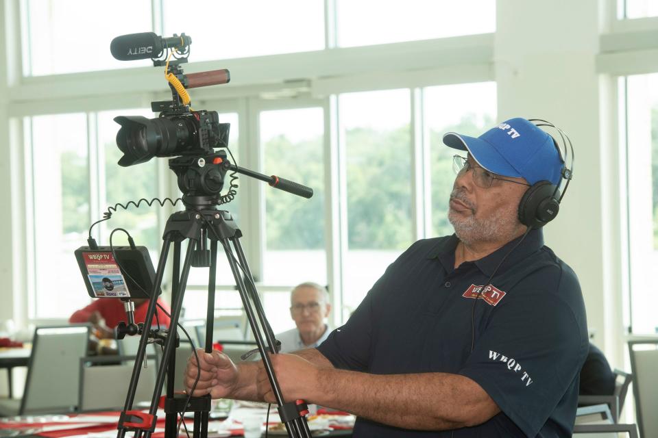 WBQP owner Vernon Watson operates a camera for a live broadcast from the field during a recent event at the Bayview Community Center on Tuesday, Sept. 26, 2023. Watson has owned and operated the public access cable network for over 30 years. 