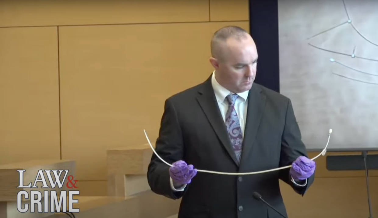 Sgt Kevin Duggan holds up bloody zip ties at Michelle Troconis’ trial (Law&Crime)